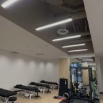 Open treatment and rehabilitation floor with tables and exercise equipment